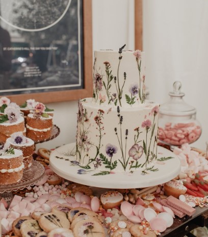 pressed flower cake with pressed flower treats on table